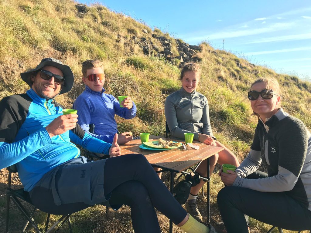 Hikers enjoying coffee during a break on their trek to the summit of Mount Rinjani.