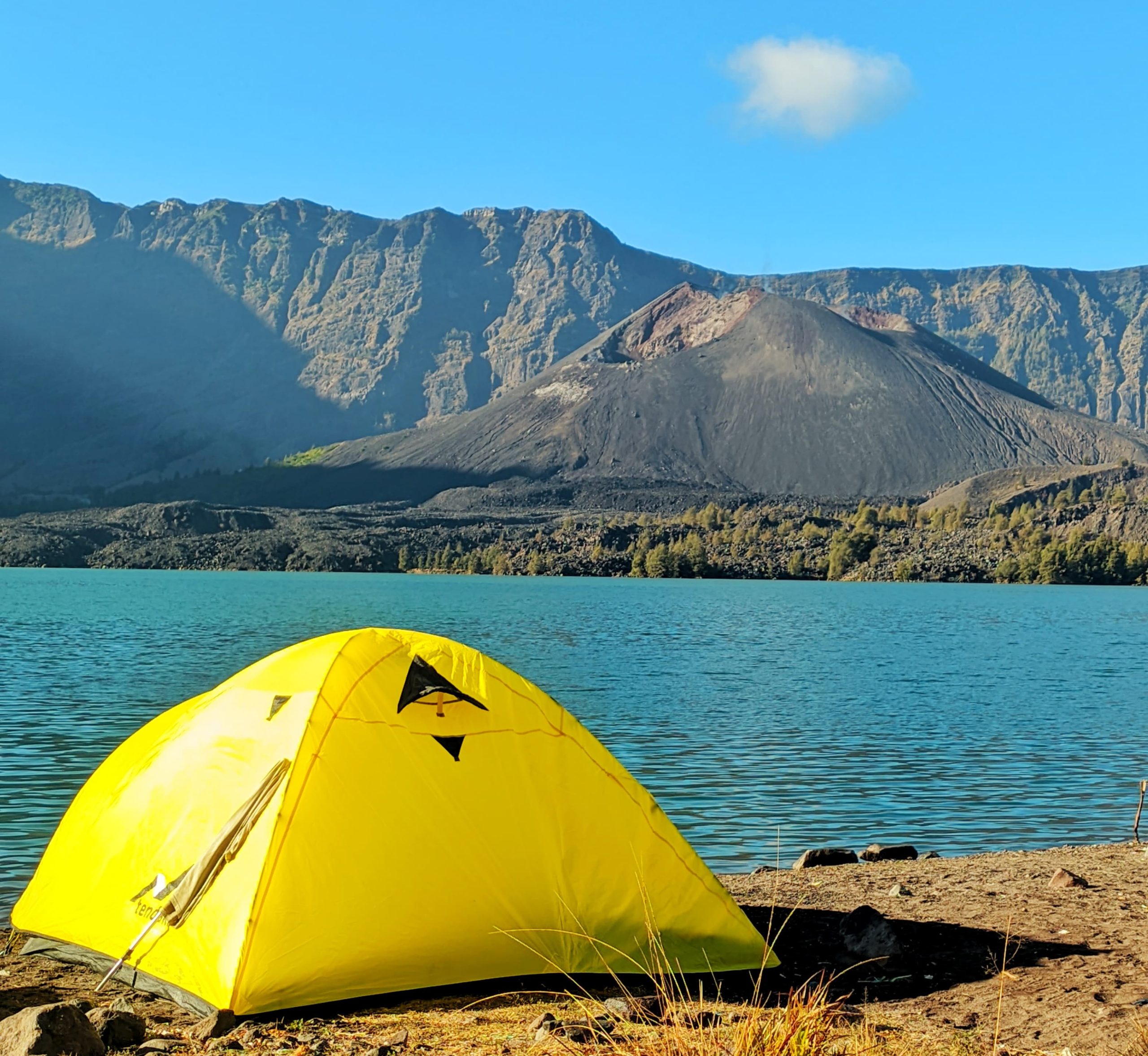 Mount Rinjani’s scenic landscapes, including Segara Anak Lake, volcanic peaks, lush forests, and surrounding mountains in Lombok, Indonesia.