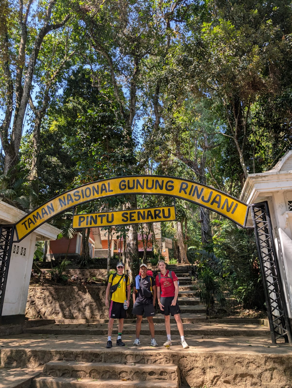 A hiker poses in front of the Senaru Gate, the entrance to one of Mount Rinjani’s trekking routes on Lombok Island, West Nusa Tenggara, Indonesia.